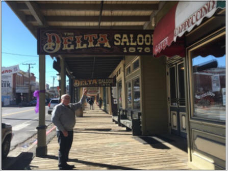 Hal Cutler points out the sign for the Delta Saloon 1876, in Virginia City, NV